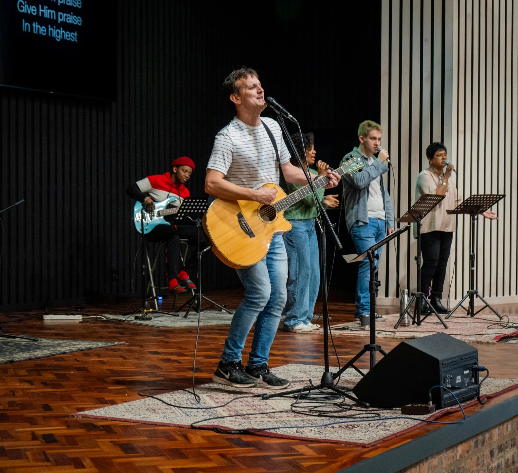 The worship team leading music at One City Church