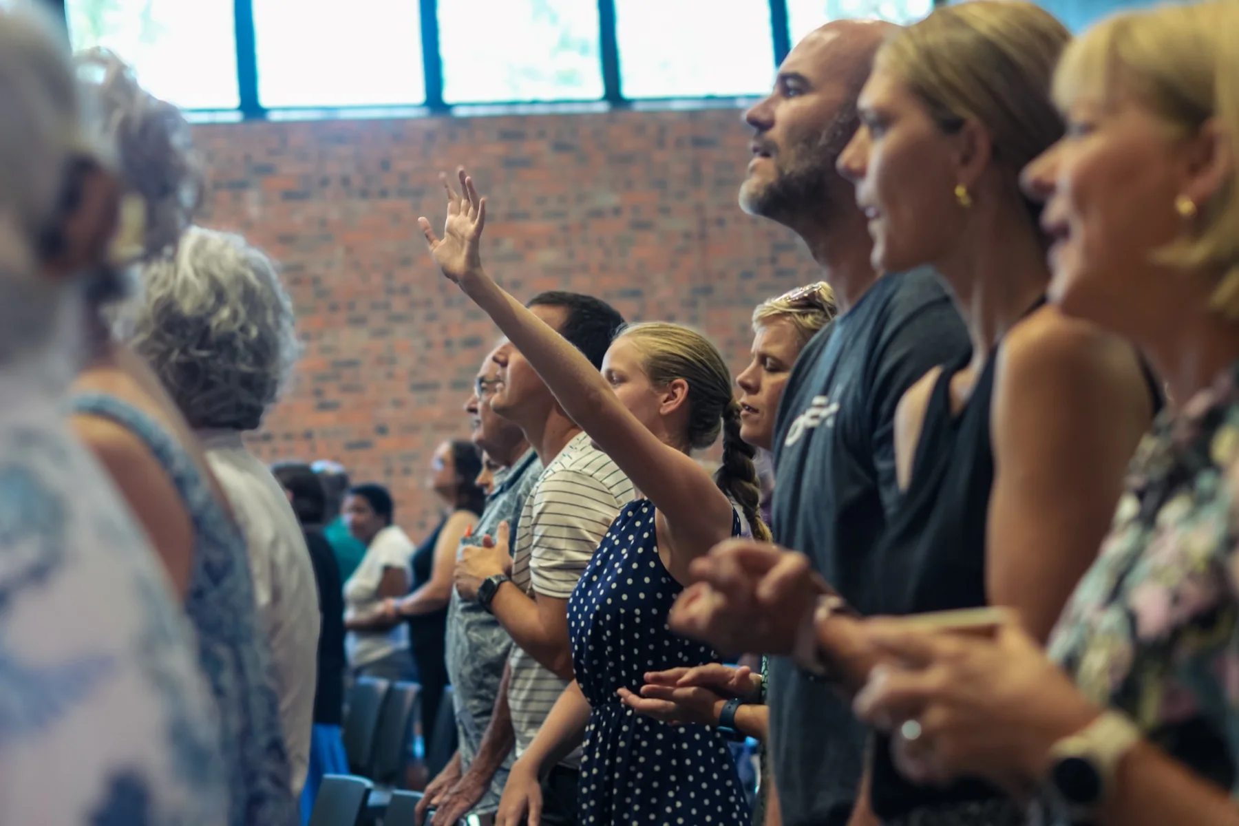 A speaker sharing a message with the One City congregation